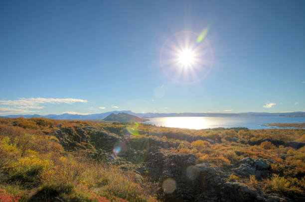 The lake lies partially within Pingvellir National Park. The volcanic origin of the islands in the lake is clearly visible. The cracks and faults around it, of which the Almannagja ravine is the largest, is where the Eurasian and North American tectonic plates meet. Silfra fissure is a popular scuba and snorkeling site.