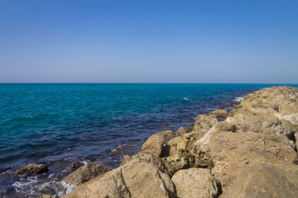 istock Breakwater by the sea, calm wave. 646176104