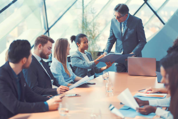 istock Businessman congratulating at the office meeting 646179248