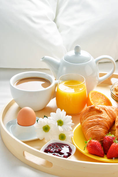 istock Breakfast tray in bed in hotel room 646186846