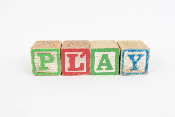 The Word Play in Wooden Childrens Blocks stock photo