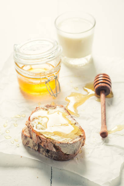 istock Sweet sandwich with honey for breakfast with milk 646189826