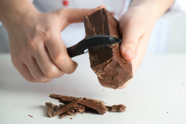istock Mixed race woman chopping chocolate 646190954