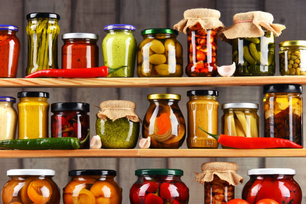 Jars with variety of pickled vegetables. Jars with variety of pickled vegetables. Preserved food preserved food stock pictures, royalty-free photos & images