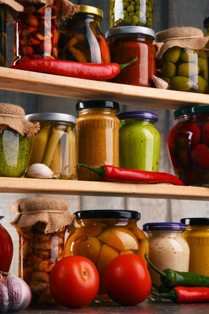 istock Jars with variety of pickled vegetables. 646203578