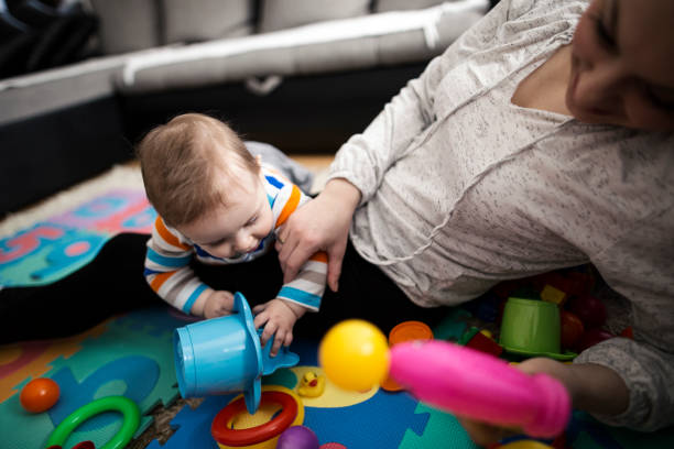 istock Mother playing with her baby boy 646206684