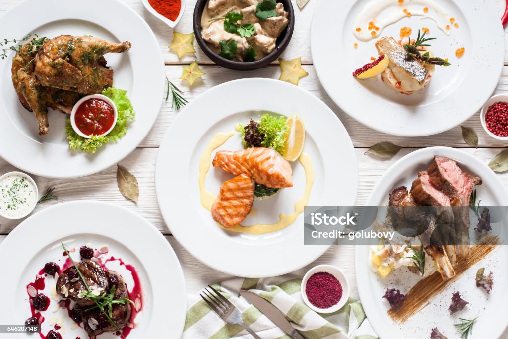 Fish and meat meals variety flat lay Fish and meat meals variety flat lay. Top view on buffet with assortment of healthy hearty food. Buffet, banquet, appetizer, restaurant menu concept Food Stock Photo