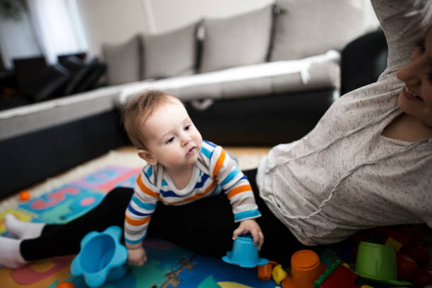 istock Mother playing with her baby boy 646207260