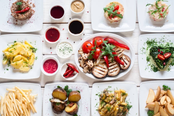 Vegetable snacks with sauces flat lay