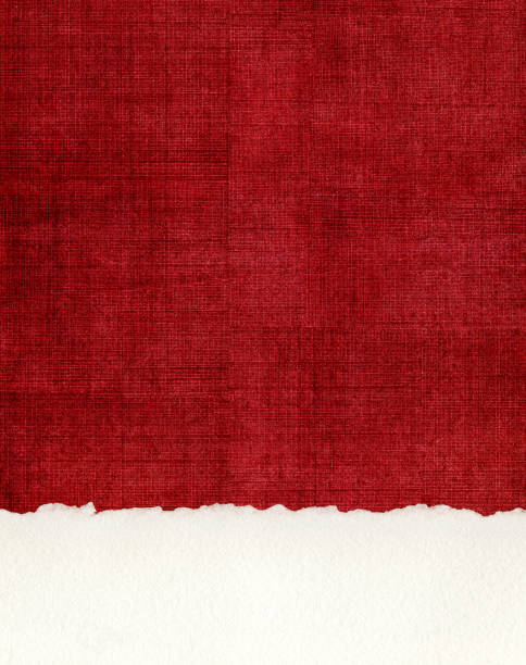 Deckled Paper Edge on Red Cloth A section of deckled edge paper on a textured, red cloth background. torn fabric stock pictures, royalty-free photos & images