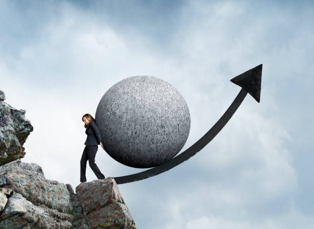 istock Businesswoman Pushing Sphere Up Arrow 646211022