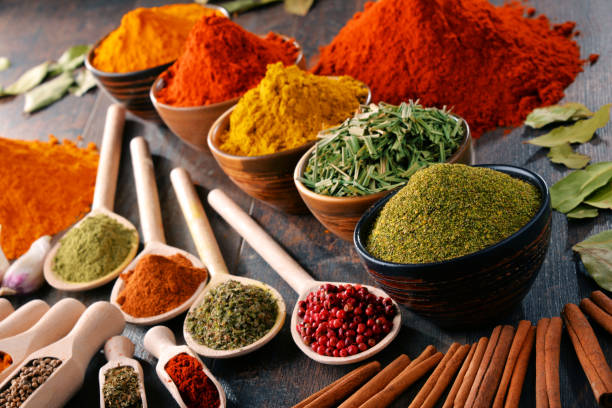 istock Variety of spices and herbs on kitchen table 646211260