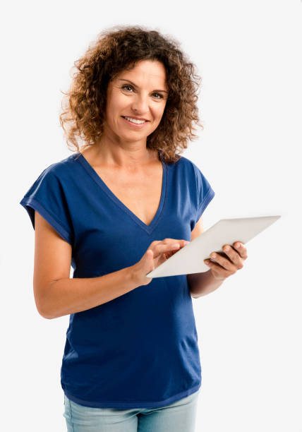 istock Happy woman working with a tablet 646218480