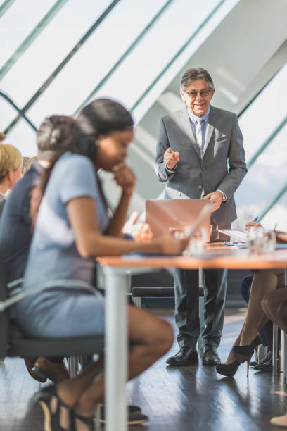 istock Senior businessman having a business presentation 646221650