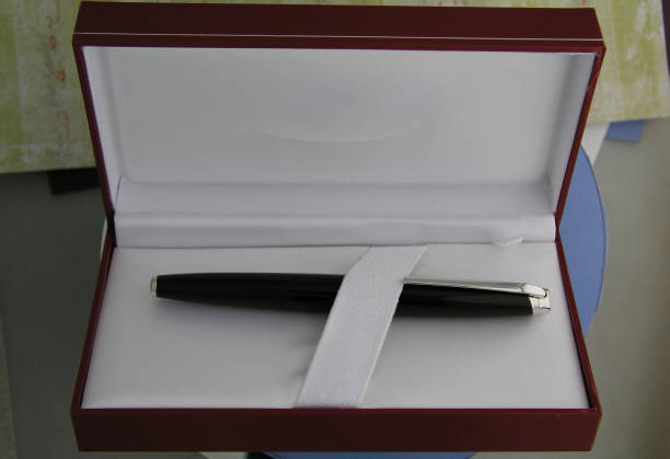 istock Black lacquer and chrome pen in a presentation box 646225252