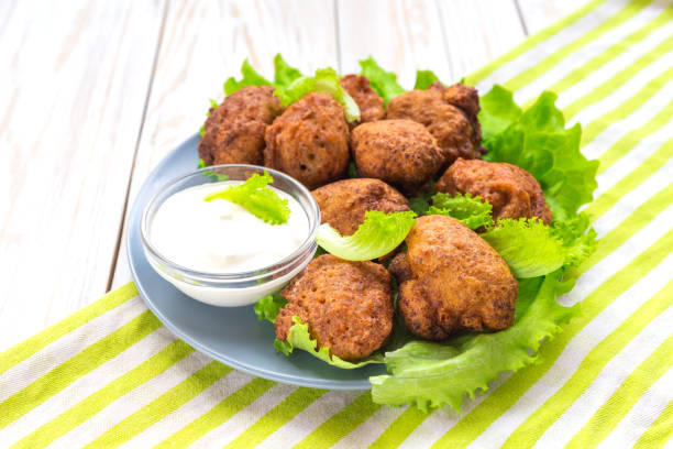 istock Acaraje or akara snack with green salad and sour cream 646226068