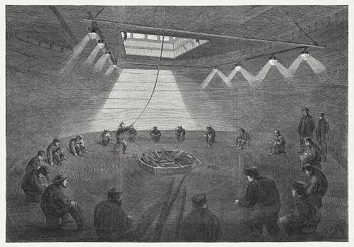 Laying of the 1st Transatlantic telegraph cable in 1865. Workers roll the cable from the huge roll in the ship's hull. Wood engraving, published in 1865.