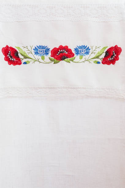 istock Embroidered floral pattern on a white linen towel 646231382