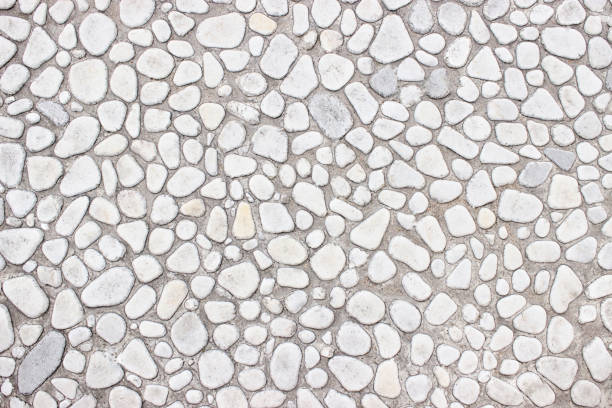 istock Wall of small stones, white background  light design 646232246