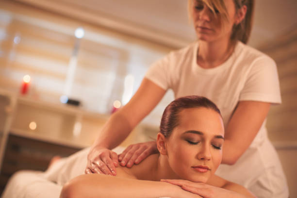istock Young woman enjoying a massage 646235036