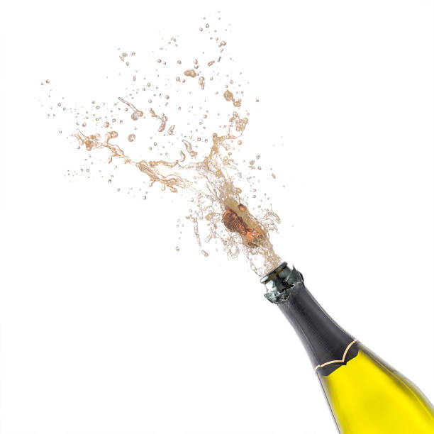 istock champagne bottle with popping corks isolated on white 646235374