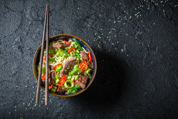 istock Hot asian noodle with beef and vegetables 646238502