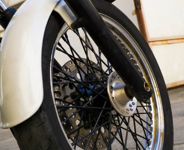 istock Chrome wheel of white motorcycle background 646239786