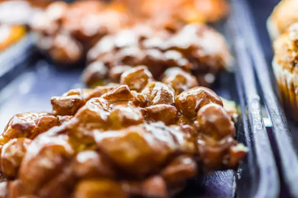 Closeup of golden apple fritter on display