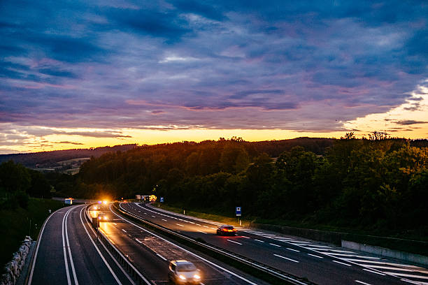 istock Cars On Road Against Cloudy Sky During Sunset 646247103