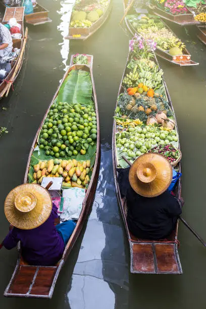 Photo of Floating market in Thailand.Damnoen Damnoen Saduak floating in Ratchaburi.