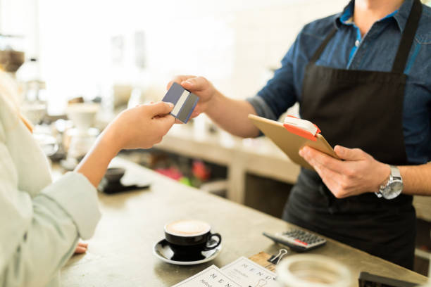 istock Using a credit card to buy some coffee 646248394