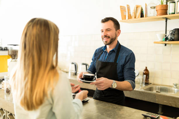 istock Barista serving coffee to customer 646250906