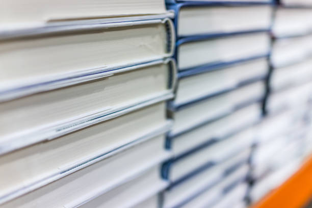 istock Stack of new books on shelf on display in store 646254766