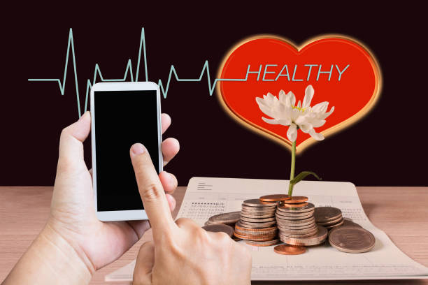 istock Hand holding cellphone or smartphone or mobile phone with money 646261762