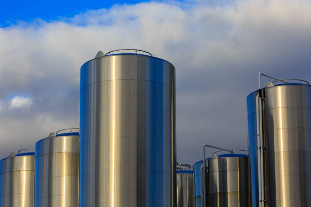 Six huge, shiny tanks of milk