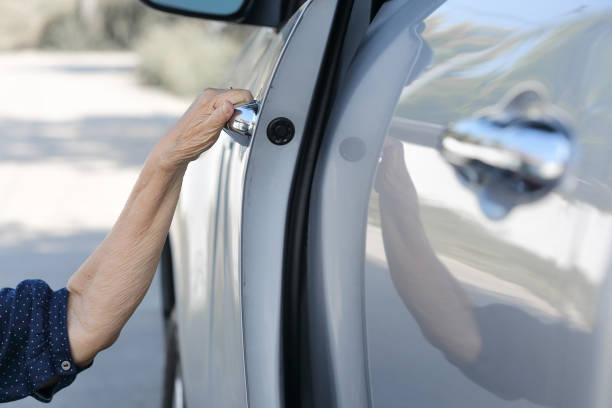 istock Elderly woman open door car 646286280