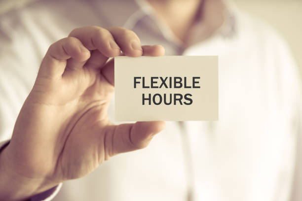 istock Businessman holding FLEXIBLE HOURS message card 646307920