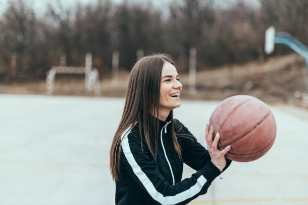istock Woman playing basketball 646316732