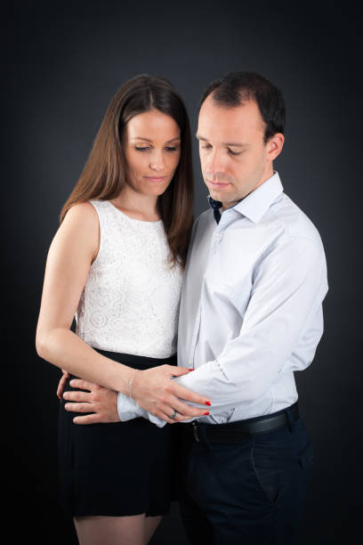 istock Beautiful couple doing different expressions in different sets of clothes: sad 646320096