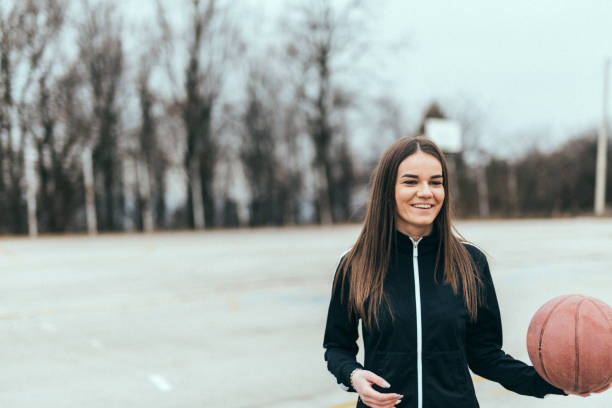 istock Woman playing basketball 646320402