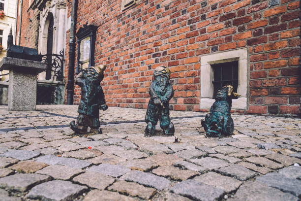 Wroclaw, Poland - September, 19th, 2016. Disabled dwarfs statues at Wroclaw Market square near Old Town hall. Bronze gnome sculptures are the main tourist attraction and symbol of the city.