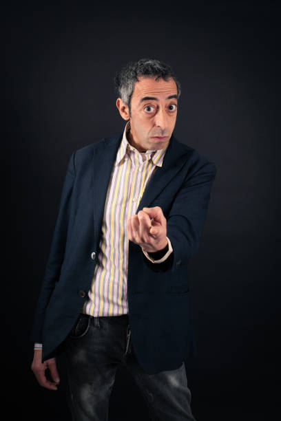 istock Handsome man doing different expressions in different sets of clothes: pointing 646325852