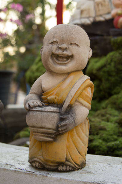 Novice little doll sculpture at Wat Phra That Doi Kham Chiang Mai,Thailand.