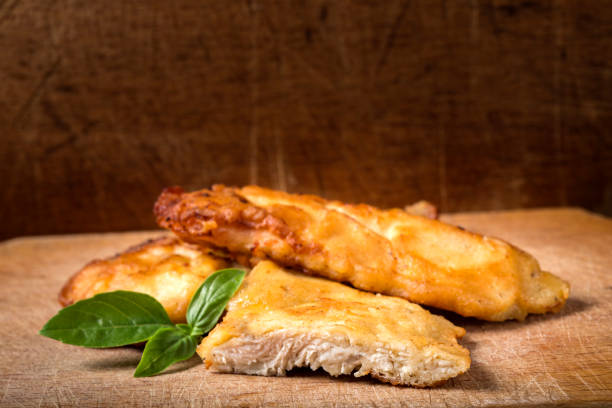 fried chicken schnitzel with basil - milanese imagens e fotografias de stock