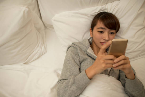 istock Young asian girl using smartphone 646338826
