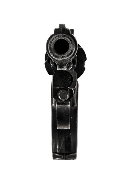 Hand holds a hand gun with smoke coming out the barrel after being fired into the air