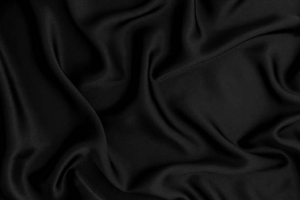 istock Close up wave red silk or satin fabric background 646341402