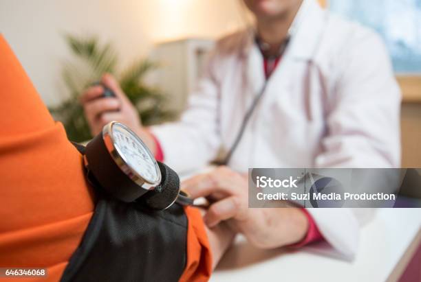 Senior Woman Having A Doctor Appointment Stock Photo - Download Image Now - Blood Pressure Gauge, Overweight, Doctor