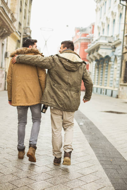 istock Two young man walking down the street 646353572