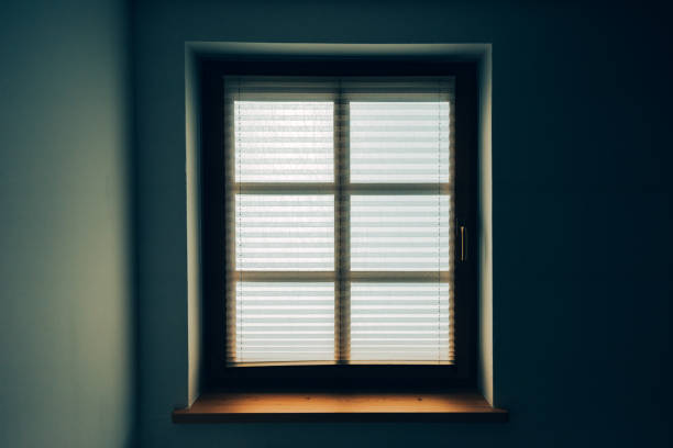 istock Bedroom window with paper curtain shade 646360414